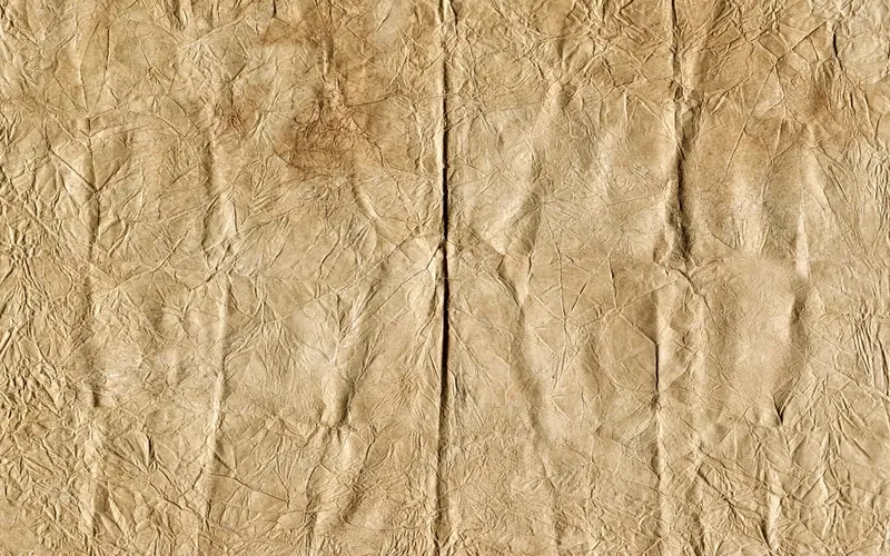 Old brown paper covered in fine creases
