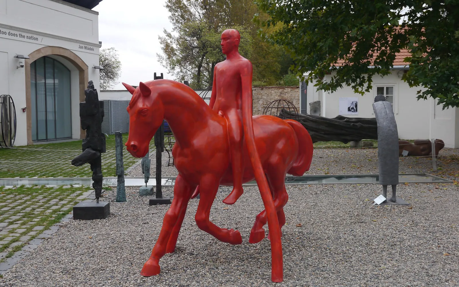 Courtyard of Museum Kampa in Prague with a red horse and rider sculpture